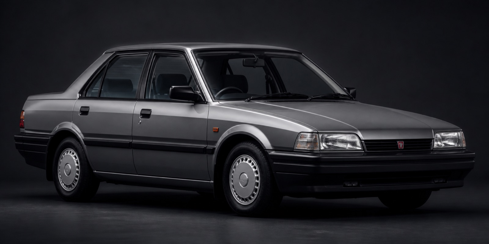 Metallic Grey Rover 216S in a dark photographic studio