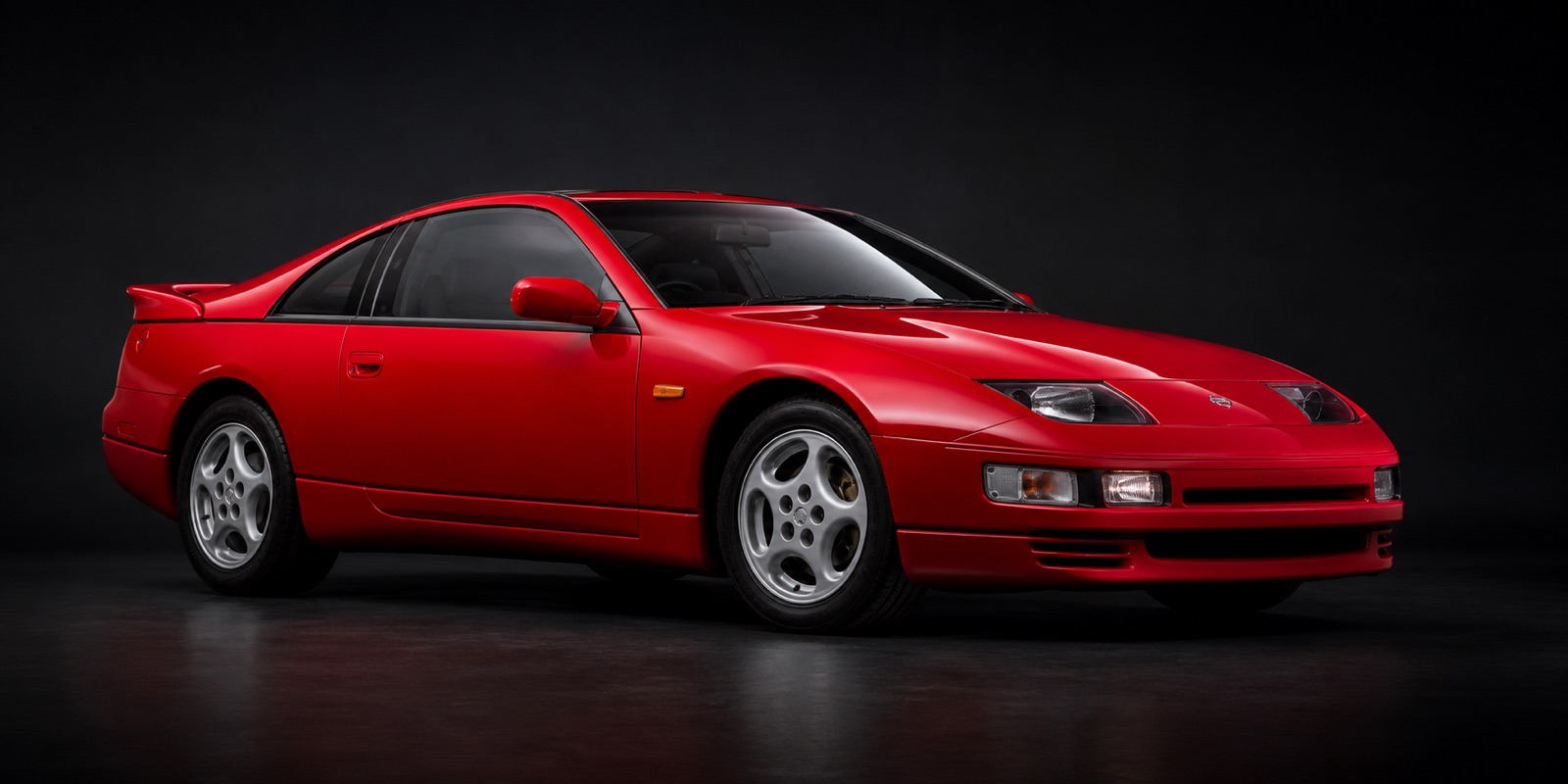 Red Nissan 300ZX in a dark photographic studio