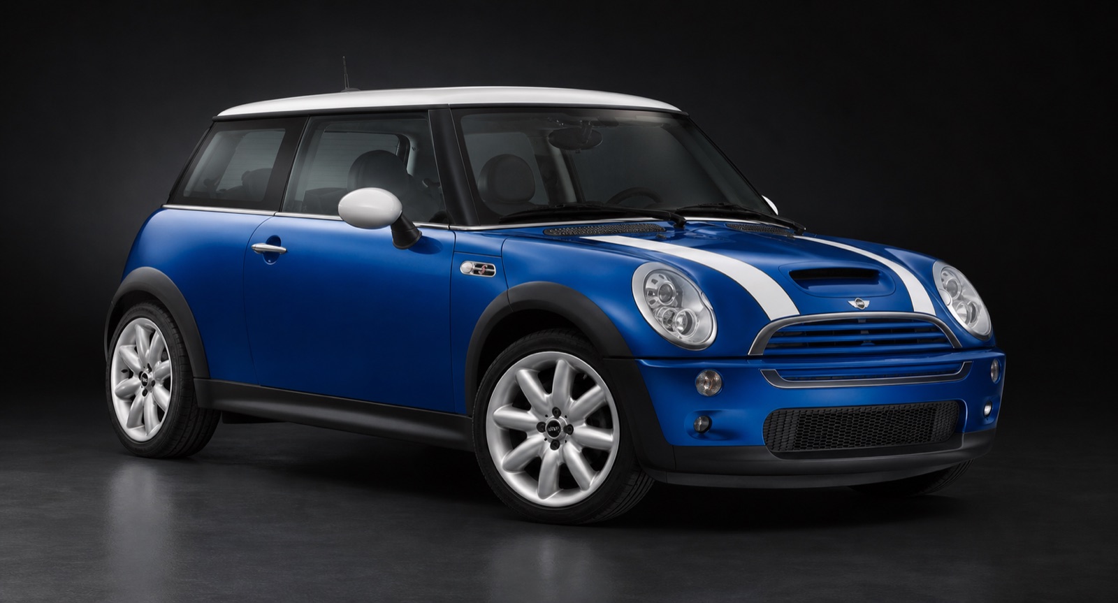 Blue (white racing stripes) Mini Cooper S in a dark photographic studio