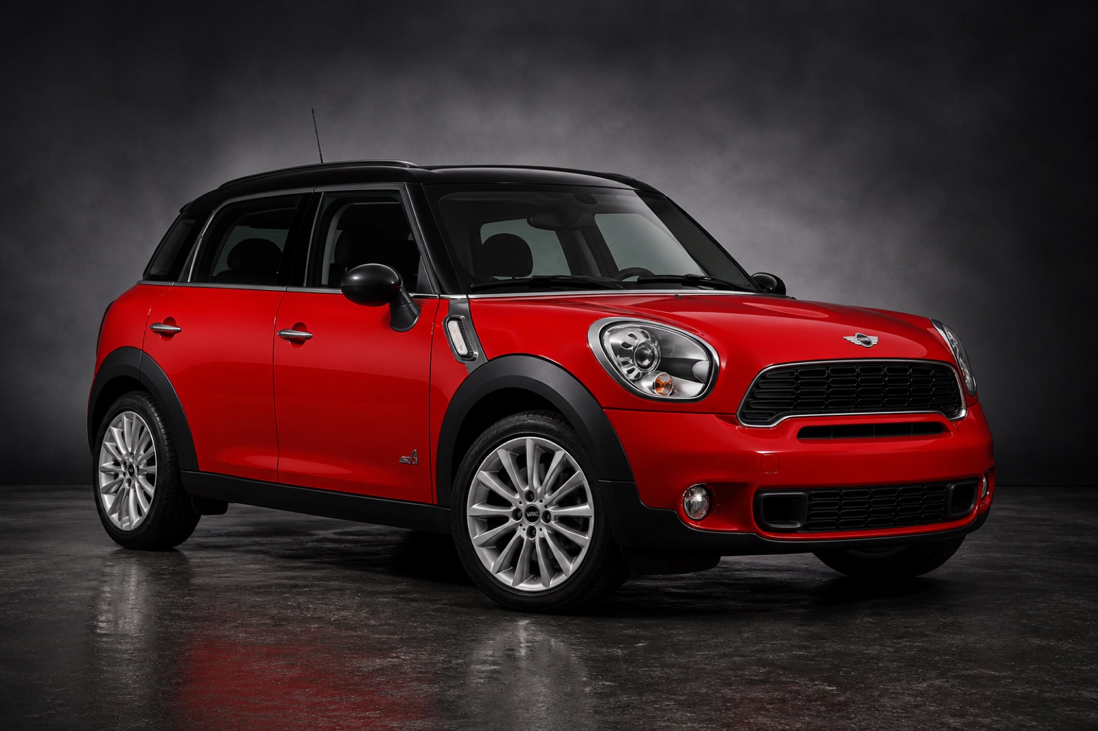 Chili Red Mini Cooper SD Countryman in a dark photographic studio