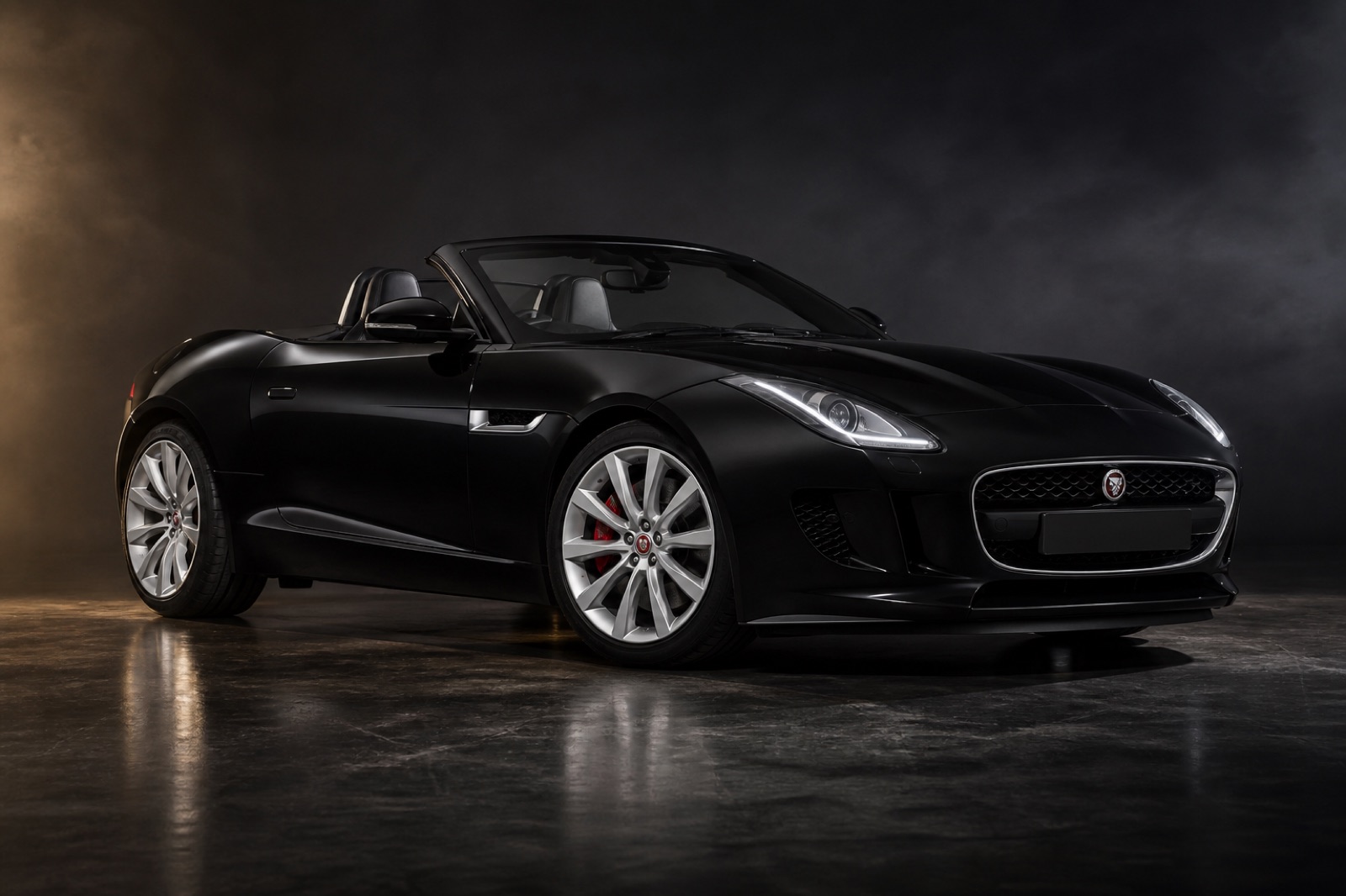 Black Jaguar F-Type in a dark photographic studio